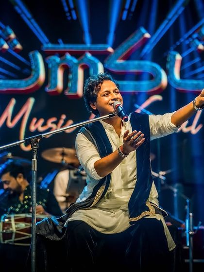 Our lead vocalist, engaging with the enthusiastic crowd at ESI-PGIMSR College.