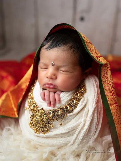Nine-day-new 'Chukki' wrapped in a divine silk saree for a Varamalakshmi Pooja themed portrait. The rich colors and traditional jewelry create a stunning and meaningful image.