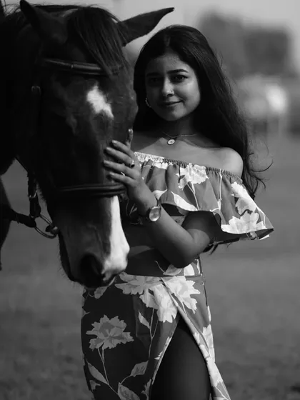 The same portrait in black and white, emphasizing the emotion and connection in the shot.