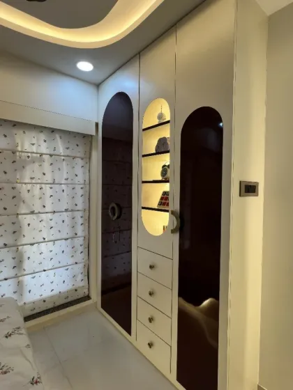 A closer look at the custom wardrobe with illuminated niches, perfect for displaying favorite toys and books.