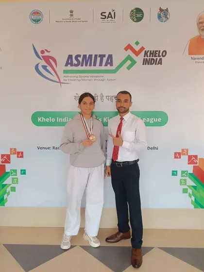Another one of our talented female athletes with her medal at the Khelo India event. We provide specialized coaching to help our women fighters excel in competitions.