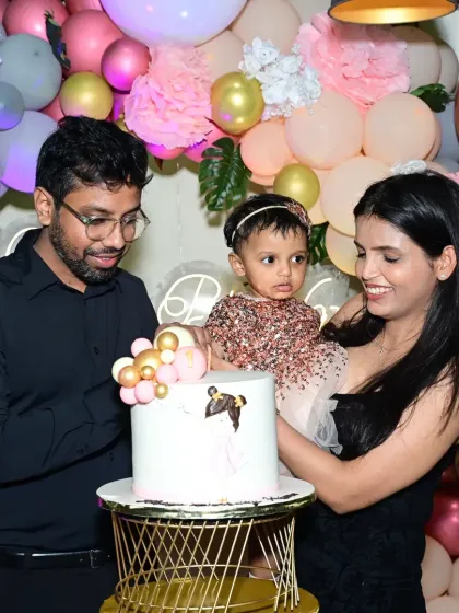 The family celebrating their daughter's first birthday at Lono Tropical. We manage the entire event so parents can relax and enjoy the special day.