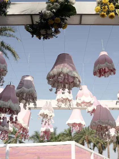 Whimsical details from a pastel-themed Haldi. I used these custom-made fringed lampshades in shades of pink and lilac to add a touch of enchantment and soft light to the daytime event.