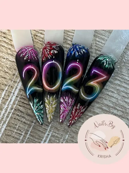 Happy New Year 2023. This nail art uses an airbrush technique to create a vibrant neon effect with fireworks.