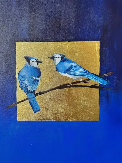 A commissioned painting of two blue jays on a branch, set against a square of shimmering gold leaf. The contrast between the detailed birds and the modern, graphic background creates a striking visual.