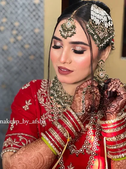 A beautiful candid moment. I created a soft, glittery eye look paired with a matte lipstick for this bride. Her jewellery, especially the passa and maang tikka, were carefully secured to frame her face perfectly.