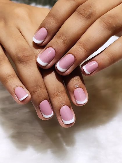 You can never go wrong with a classic French manicure. This is a beautifully executed, clean look on short, square-shaped nails with a pink base and crisp white tips.