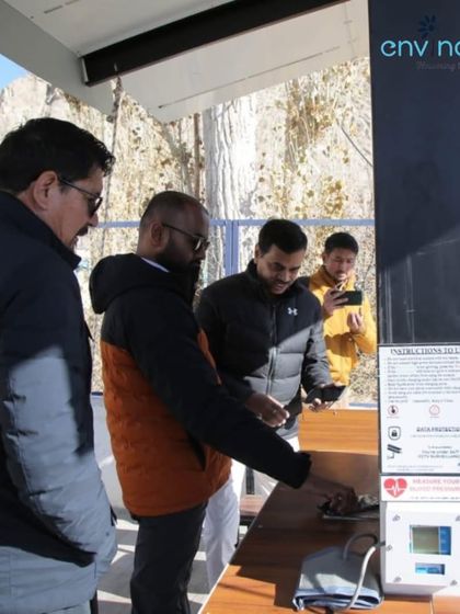 Officials inspect the health monitoring features of our solar hut in Leh. The ability to check vital signs like blood pressure and body temperature provides an essential service in this high-altitude region.