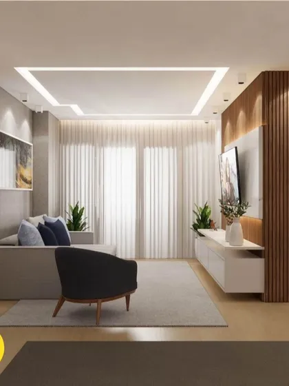 A minimalist living room with a simple sofa, a sleek TV unit against a fluted wood wall, and soft, ambient lighting. This design is perfect for creating a calm and relaxing atmosphere.