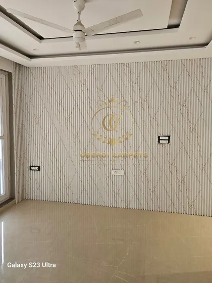This empty room is transformed with our white marble-textured fluted panels, featuring a subtle geometric pattern. It's a perfect canvas for any style of furniture and decor.