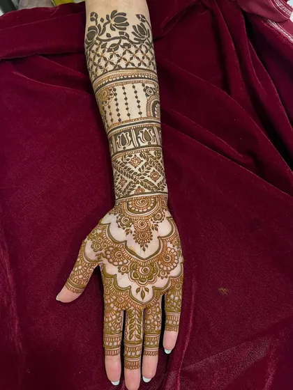 A unique design created to work around the bride's existing tattoo, blending new art with her personal story.