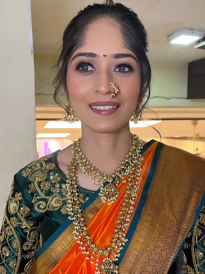 A smiling portrait of our real bride, looking happy and confident.