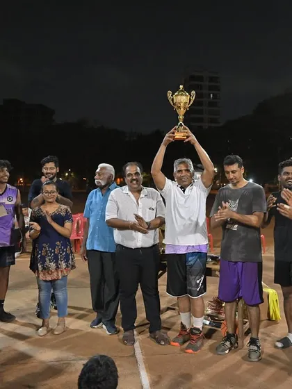 The runners-up of the Hooplah '25 Men's Division, Team Illuminati, holding their trophy. They played with heart and showed true sportsmanship.