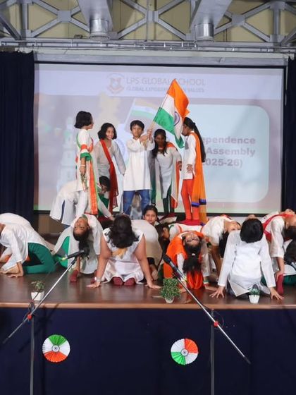Students create a human pyramid during a powerful dance performance for the Independence Day assembly. Such performances showcase their teamwork, strength, and patriotic spirit.