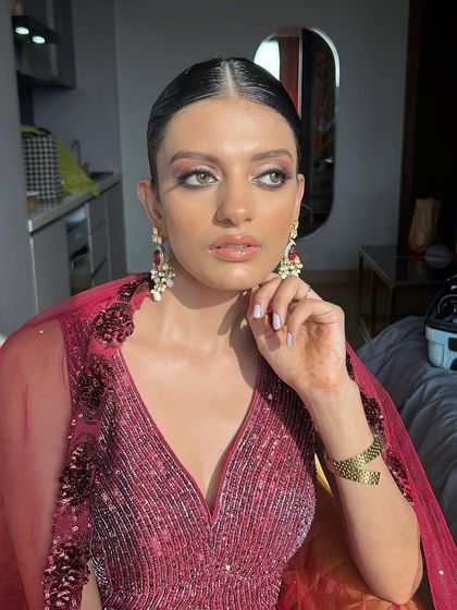 Another beautiful angle of this modern party look, showcasing the dewy finish on the skin and the perfectly blended eye makeup.