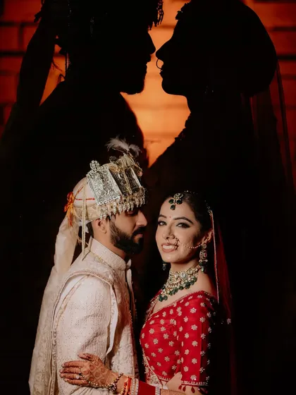 We love playing with light and shadow to create artistic and memorable wedding portraits. This silhouette shot is a perfect example of how we turn a simple moment into a piece of art.