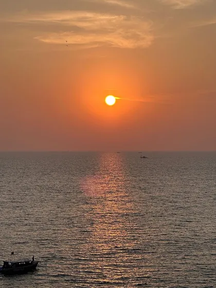 It's not all mountains. We also chase sunsets over the ocean. Imagine ending your day with this breathtaking view on our Gokarna beach trip. Salty air, golden skies, and good company.