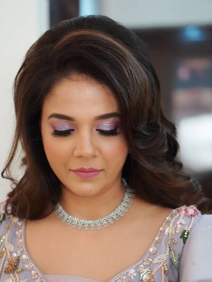 Another angle of Nilofar's "barbie in fairy land" engagement look. The soft focus on the glittery eyeshadow highlights the whimsical and romantic feel of her makeup.