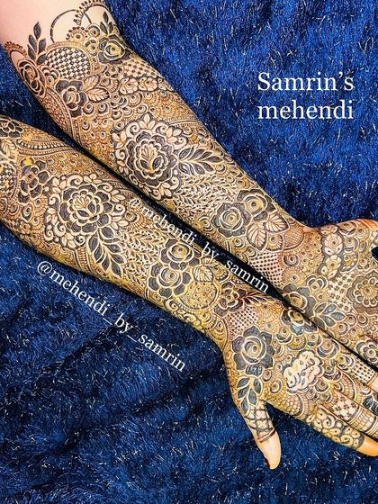 A luxury bridal design with a beautiful mix of floral and traditional patterns. The use of negative space and shading creates a stunning effect.