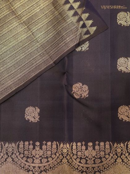 The full view of the royal blue Kanjivaram with its floral buttas and contemporary border design.