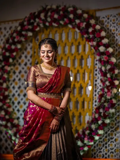 A full view of this bride's ring ceremony look, featuring a traditional half-saree.
