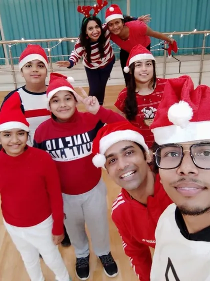 A festive selfie with our students during the Christmas Eve session. Everyone is in their Santa hats, ready to celebrate with some Christmas-themed dance and fun.