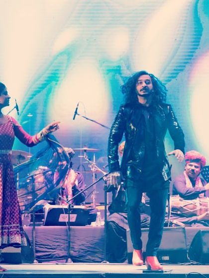 A vibrant stage photo from a private concert in Delhi, with my Kathak partner and folk musicians.
