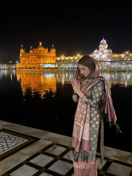 Another moment of peace at the Golden Temple. The elegance of this brocade suit stands out against the serene backdrop, showcasing a classic and respectful ethnic look.