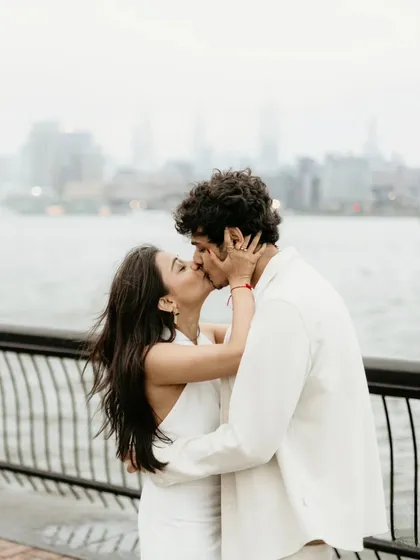 A love story sealed with a kiss, with the city as their witness. After the big surprise, we take a few moments for a mini-session. No awkward posing, just you two soaking it all in. This is about capturing that electrifying chemistry.