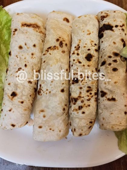 Four delicious Smokey Chicken Rolls, a filling and tasty snack option.