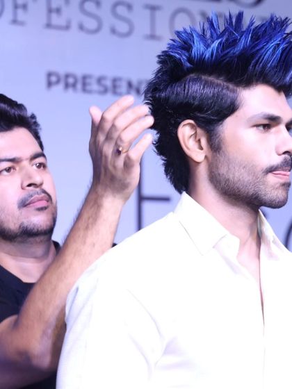 Performing live at the Beautech Cosmetic & Salon Expo. Here, I'm creating an edgy, high-fashion look with vibrant blue color and a spiky texture.