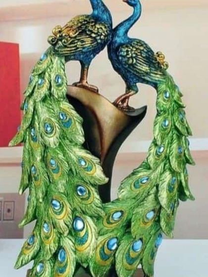 Another finished piece from the clay art class. This one features a pair of peacocks with vibrant green and blue feathers. The kids feel so proud when they create something like this.