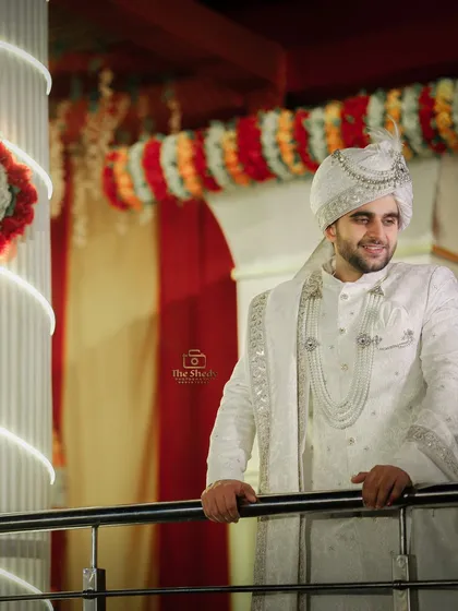 A happy and candid-style portrait of the groom, Tayab Ahmad, smiling during his wedding ceremony. We capture the joy of the groom just as much as the bride's.