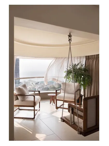 A home should be a sanctuary. For this Mumbai residence, we designed a custom bay window swing, creating a serene corner that captures the sea breeze and offers a tranquil escape from the city, demonstrating our love for maximizing views and natural light.