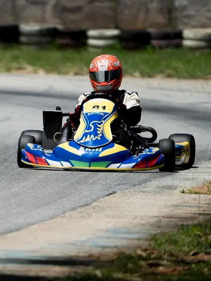 A front view of our driver in the number 81 kart on track.