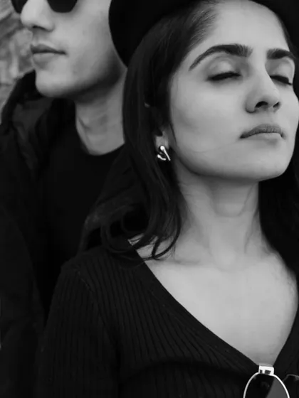 A serene and soulful black and white portrait from the Azerbaijan series. Her closed eyes and the quiet presence of her partner create a moment of peaceful intimacy and trust.
