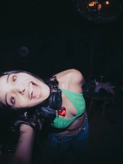 A wide-eyed selfie from behind the decks. Pure excitement and joy.