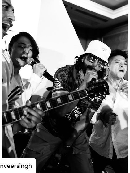 A black and white shot of the high-energy jam with Ranveer Singh, reposted from his own profile.