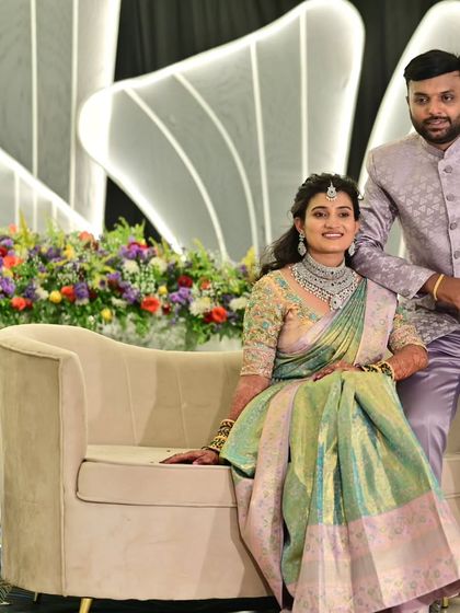A stunning couple at their reception. The bride chose a contemporary diamond-finish jewellery set that looks elegant and sophisticated with her pastel saree.