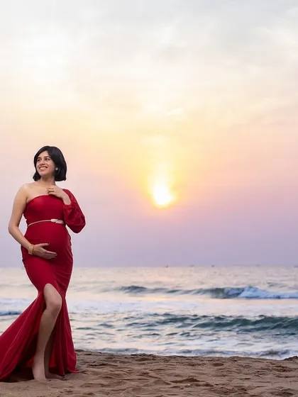 A vibrant red gown against the golden sunrise on Chennai's ECR. This is one of our most requested shots, capturing the bold, beautiful energy of a new beginning with the serene backdrop of the sea.