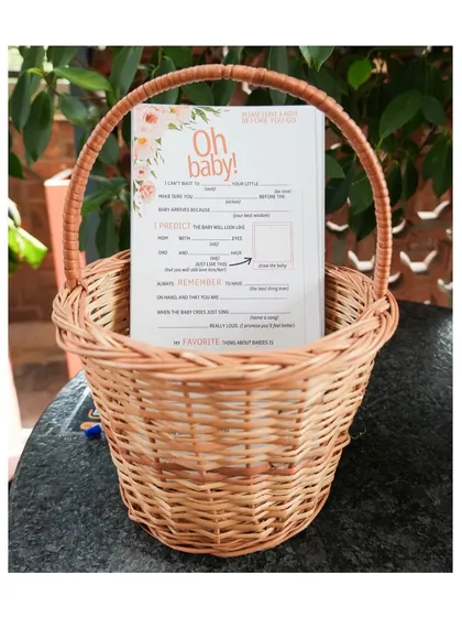 A clear shot of the baby shower game cards, showing the custom design that ties into the event's overall theme and color scheme.