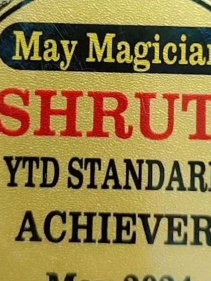 A close-up of my "May Magician" medal for being a YTD Standard Achiever. Consistent performance is key in the legal field.