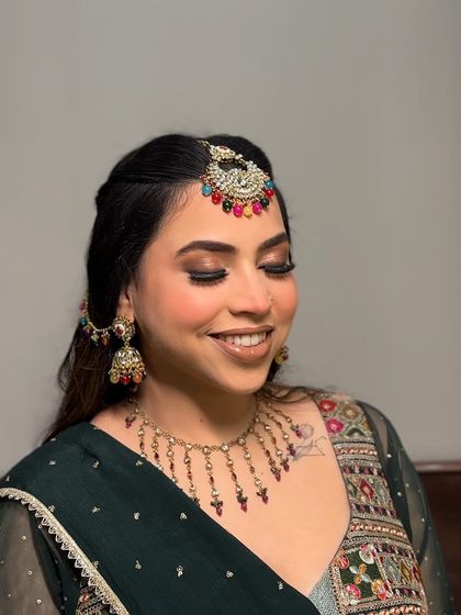 My work, completely unedited, on this super gorgeous client for her pre-wedding function. I created a warm, smokey eye with a glossy nude lip, which looked beautiful with her colorful jewelry.
