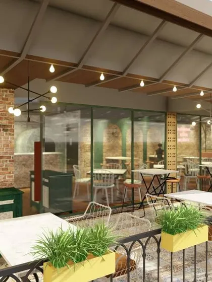 This render focuses on the facade and entrance to the patio, highlighting the use of planters and varied lighting to attract passersby on a busy street.
