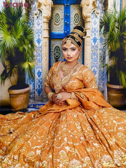 This wide shot shows the full grandeur of the Madhubala look, with the flowing lehenga and opulent styling.
