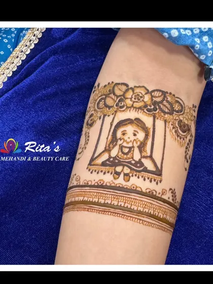 A close-up of a cute little girl on a swing, a charming detail from a custom baby shower mehendi.
