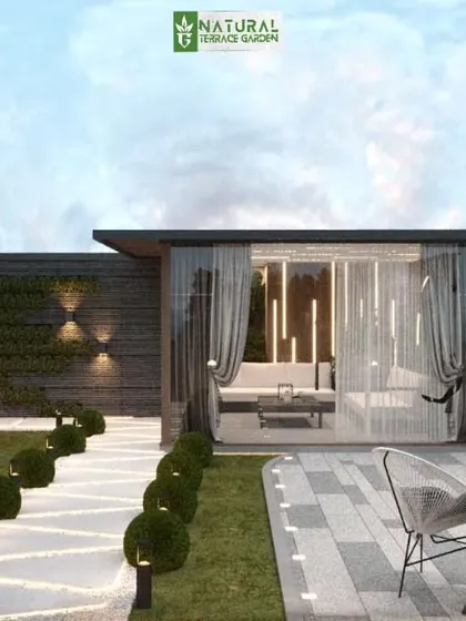 A wider view of the Vikaspuri concept, showing the glass room in context with the surrounding landscape design, including a Buddha statue and manicured topiary.