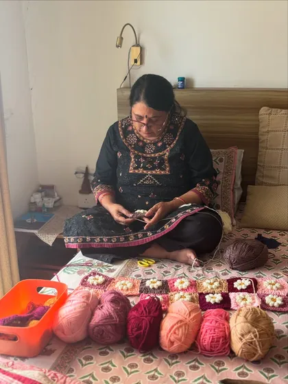 Here I am, surrounded by the beautiful yarn colors for a Daisy blanket. Every project starts like this, with careful color selection and a vision. This is my happy place, where I turn balls of yarn into something beautiful for your family.