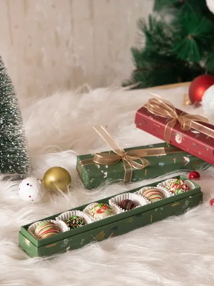A slim, elegant box filled with our Christmas-themed chocolate bonbons. A perfect stocking stuffer or small gift.