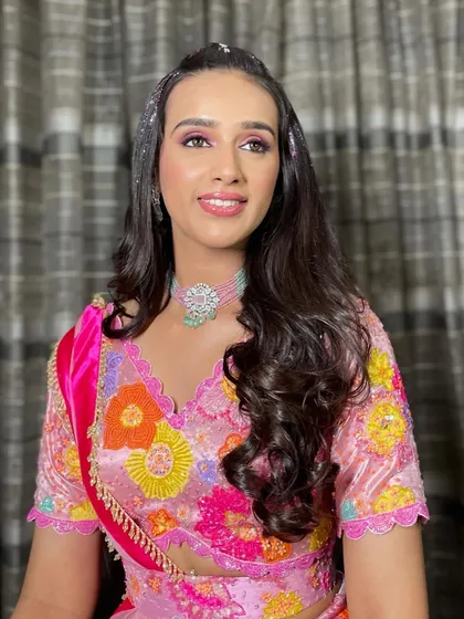 The full look of the bride with her glitter hair, looking radiant and ready for her Mehendi function.